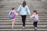 Mother walking with children