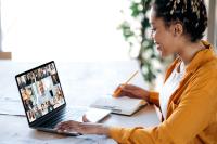 Image of woman working on her laptop joining an online training course 