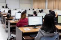 Image of students seated in a computer lab