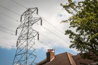 Image of powerlines passing over a residential home