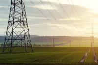 Electricity pylons across a field