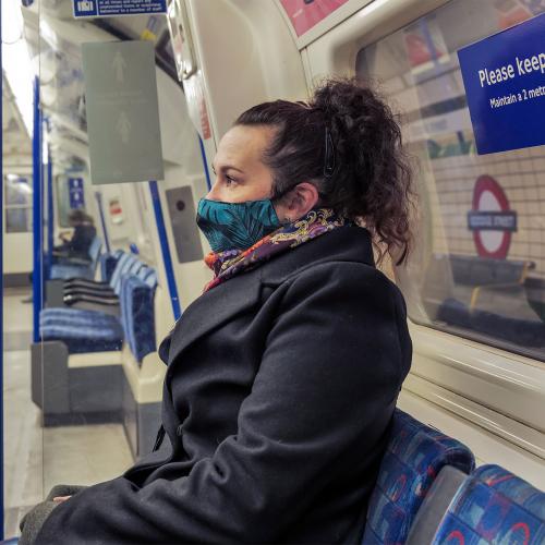 Woman wearing mask on tube
