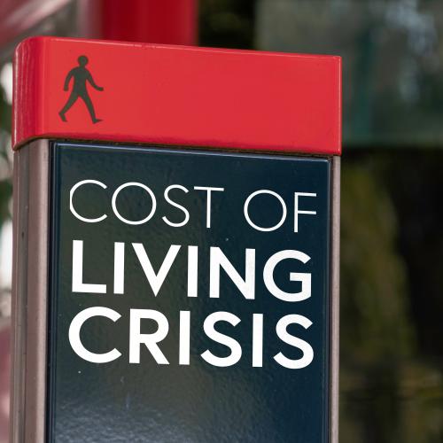 Signpost saying COST OF LIVING CRISIS
