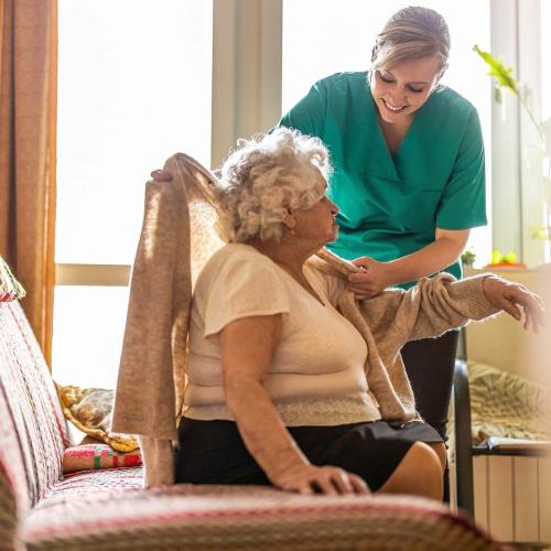 Social care worker with elderly patient