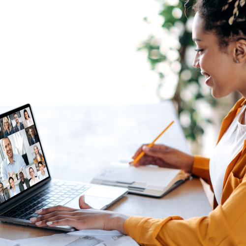 Image of woman working on her laptop joining an online training course 