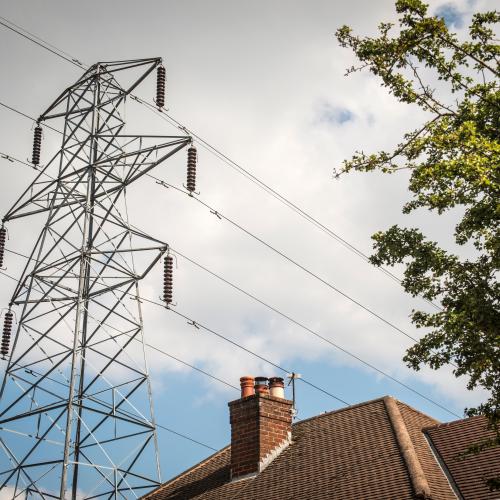 Image of powerlines passing over a residential home