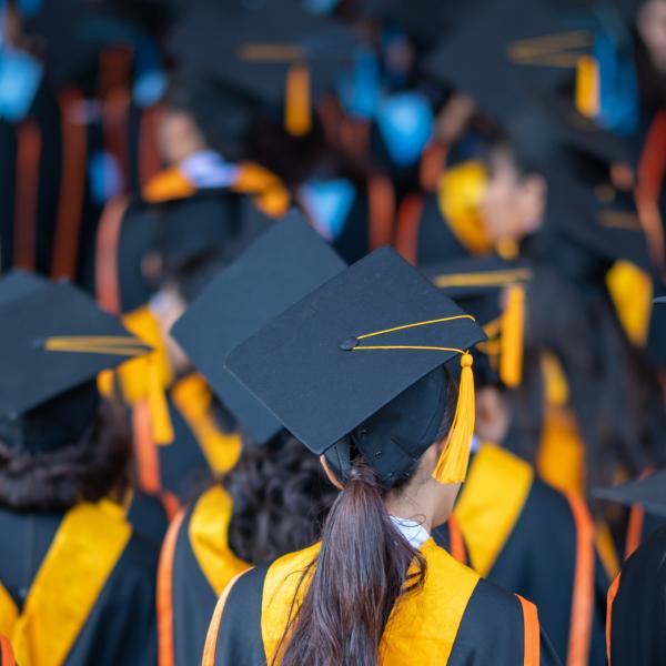 An image of students dressed for graduation