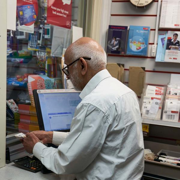Older worker in post office
