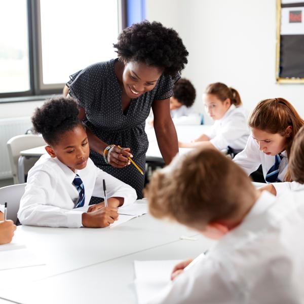 Image of teacher and Students in UK School