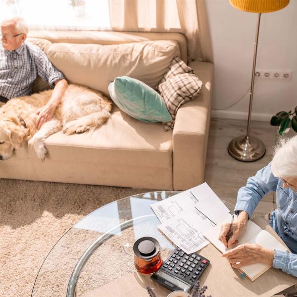 Elderly couple looking at paperwork