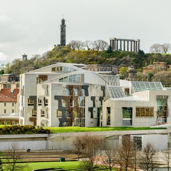 Image of the Scottish Parliament building with Calton Hill behind