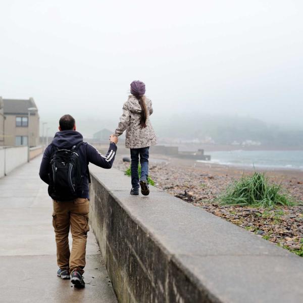 father and daughter rainy day